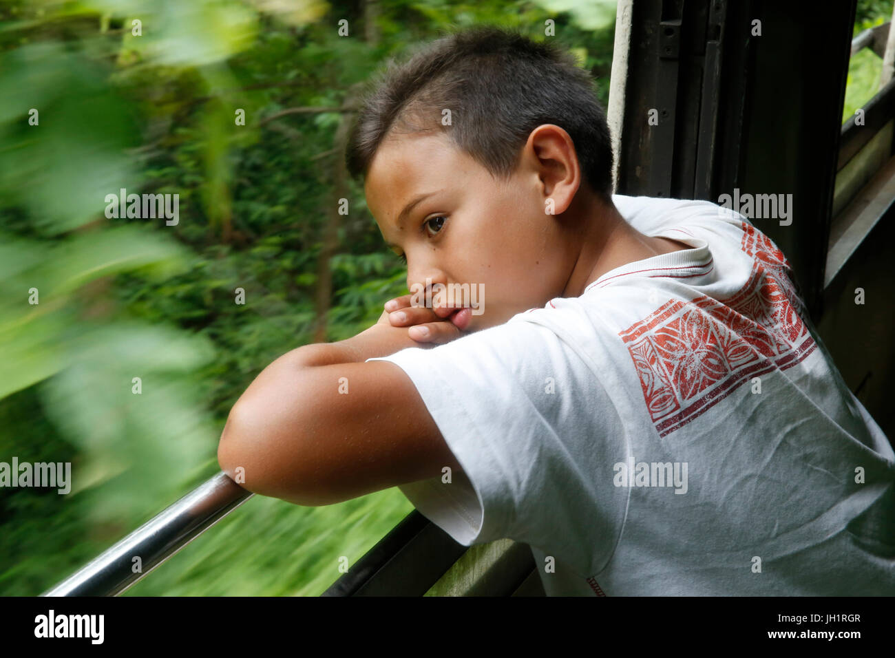 10-year-old boy traveling by train in Thailand. Thailand. Stock Photo