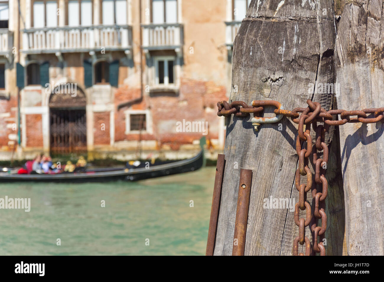 mooring posts in venice canal Stock Photo