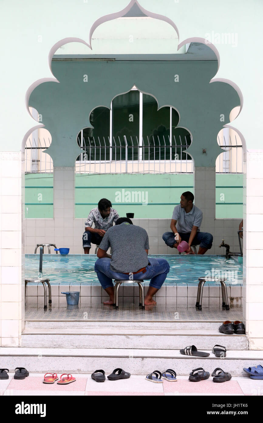 Masjid Musulman (Saigon Central Mosque). Muslims performing ablution prior to Salat. Ho chi Minh City. Vietnam. Stock Photo