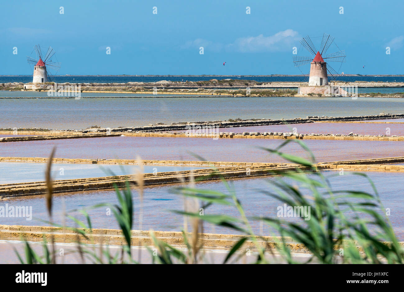 Saltpans And Windmills In The Stagnone Lagoon Between Marsala And saltpans-and-windmills-in-the-stagnone-lagoon-between-marsala-and