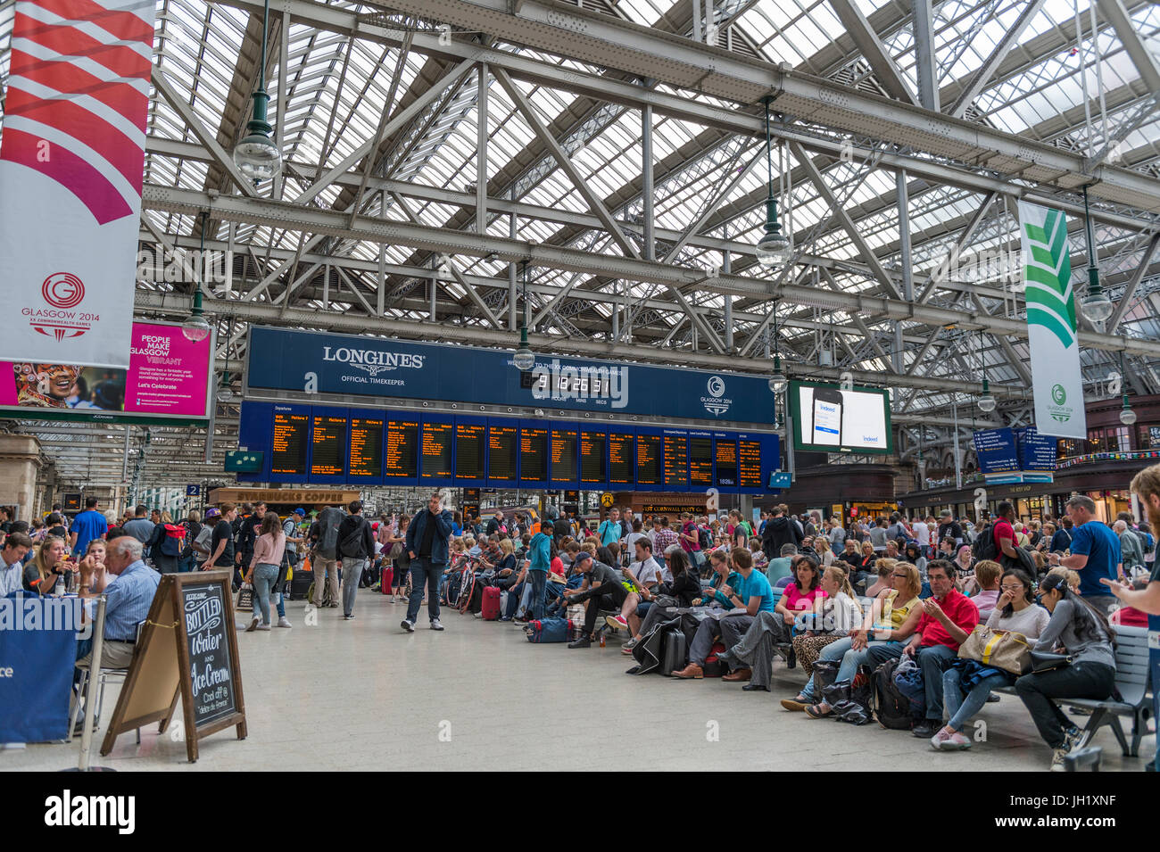 Glasgow, Scotland, UK - August 1, 2014: Members of the public on the concourse of Central Station during the 2014 Commonwealth Games in Glasgow.zz Stock Photo