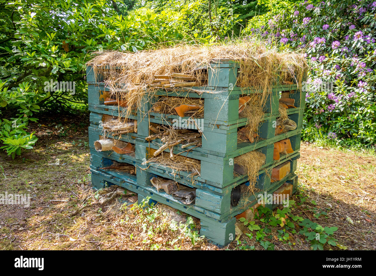 large bug hotel made from wooden pallets Stock Photo