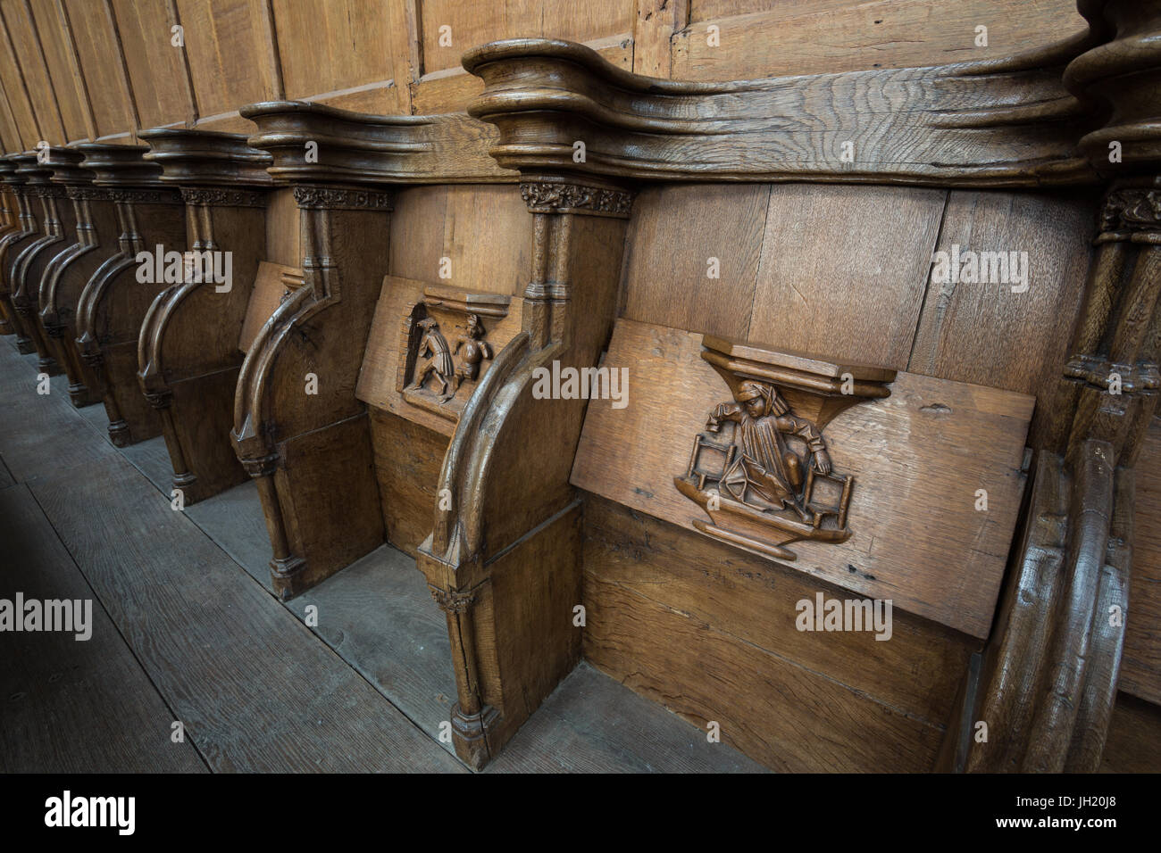 OLD CHURCH OR DE OUDE KERK, AMSTERDAM, THE NETHERLANDS - JULI 7, 2017: Old wooden misericords. Stock Photo