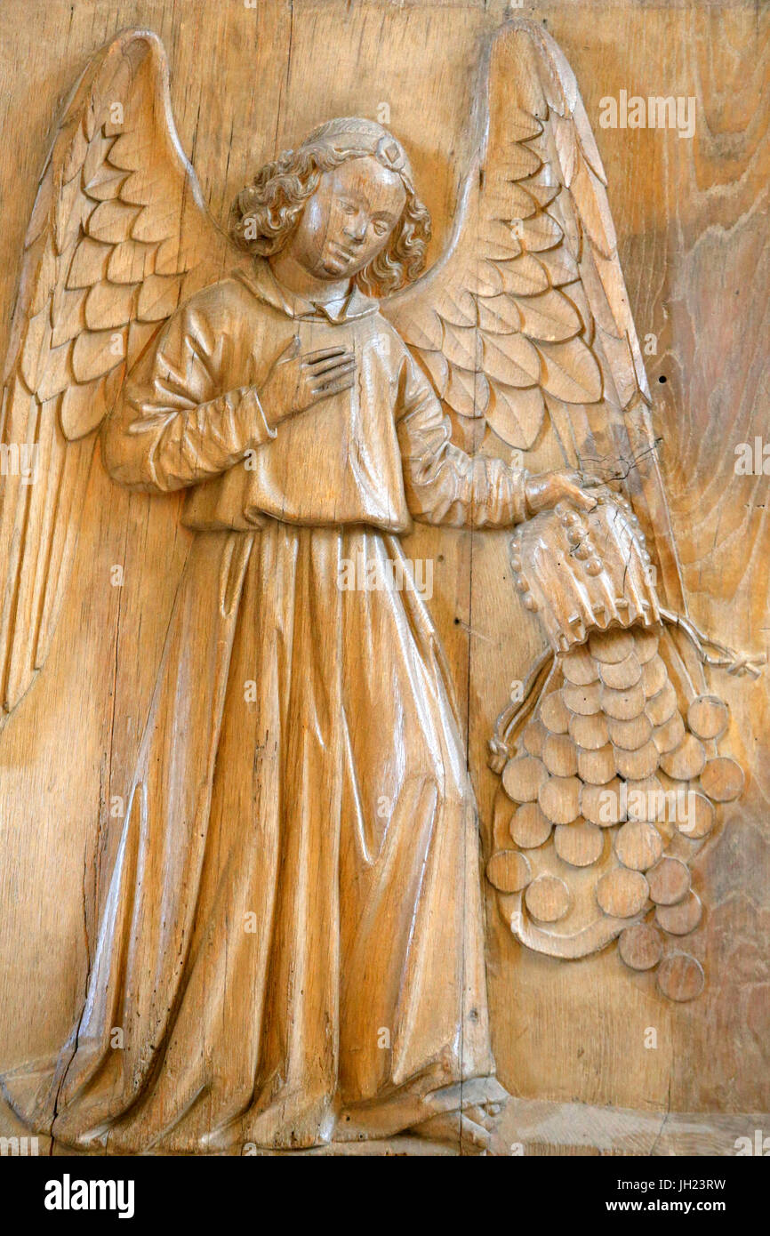 Louvre museum. Angel carrying Judas's purse. Oak wood. Touraine, 15th century. Stock Photo