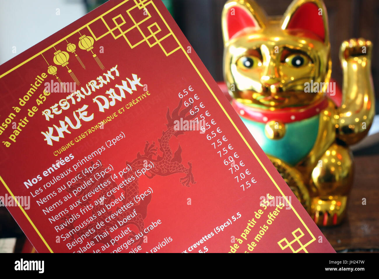Menu and The Maneki-neko also known as Welcoming Cat, Lucky Cat, Money Cat, or Fortune Cat. Stock Photo