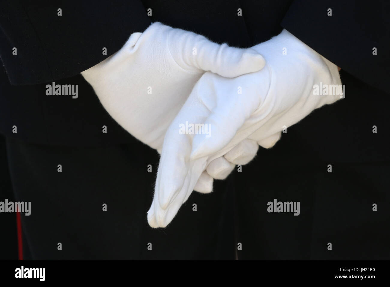 who wears white gloves