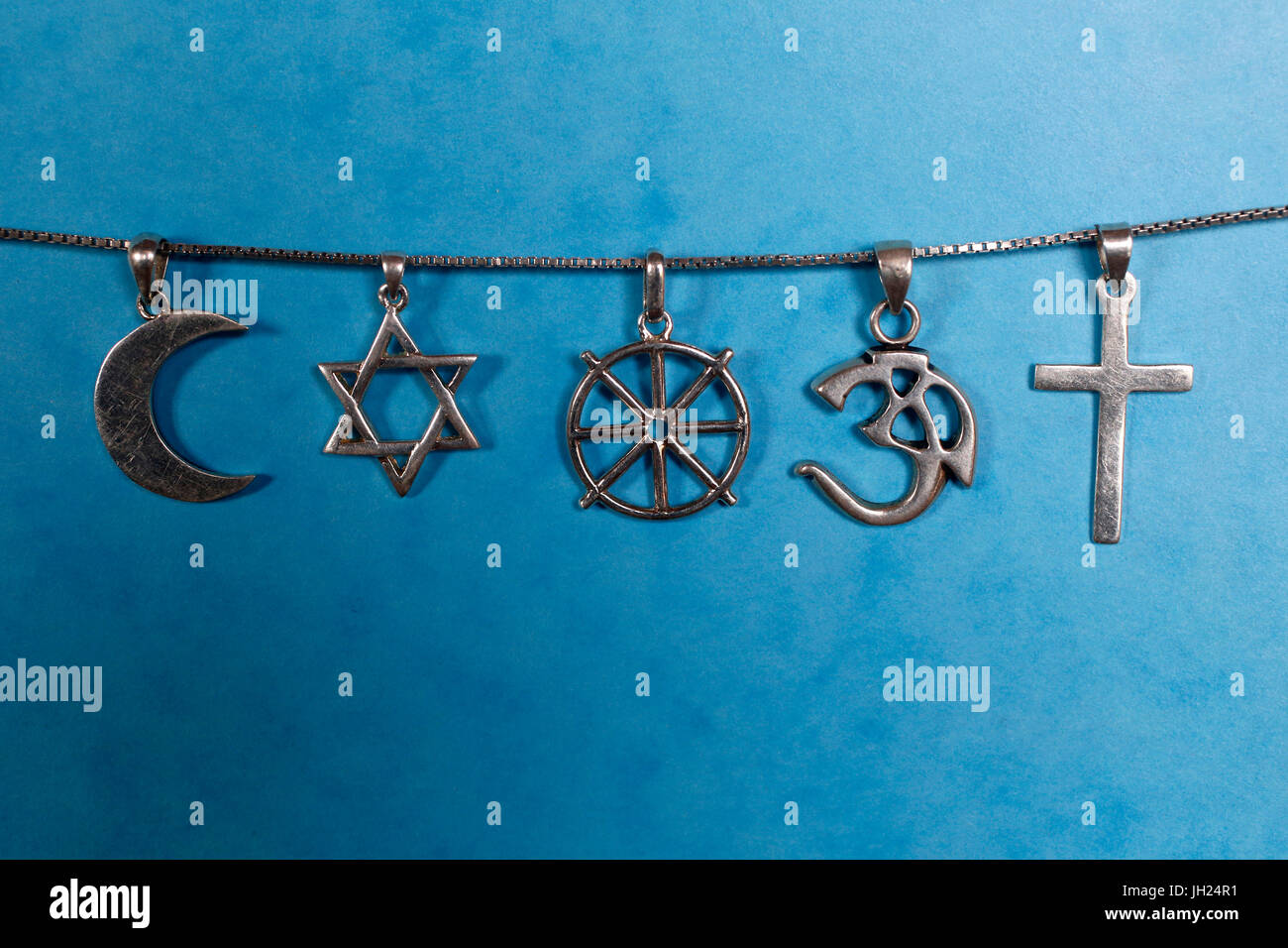 Symbols of islam, judaism, buddhism, hinduism and christianity. Stock Photo