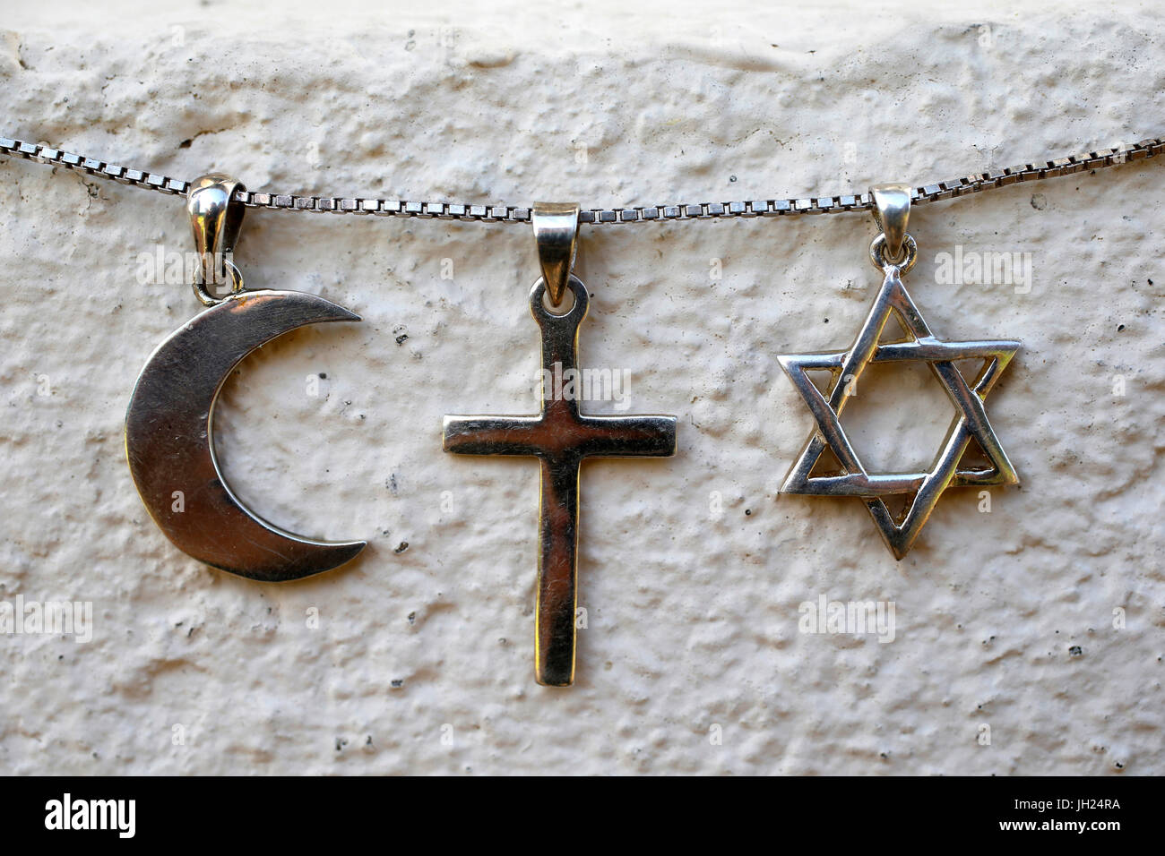 Symbols of islam, christianity and judaism. Stock Photo