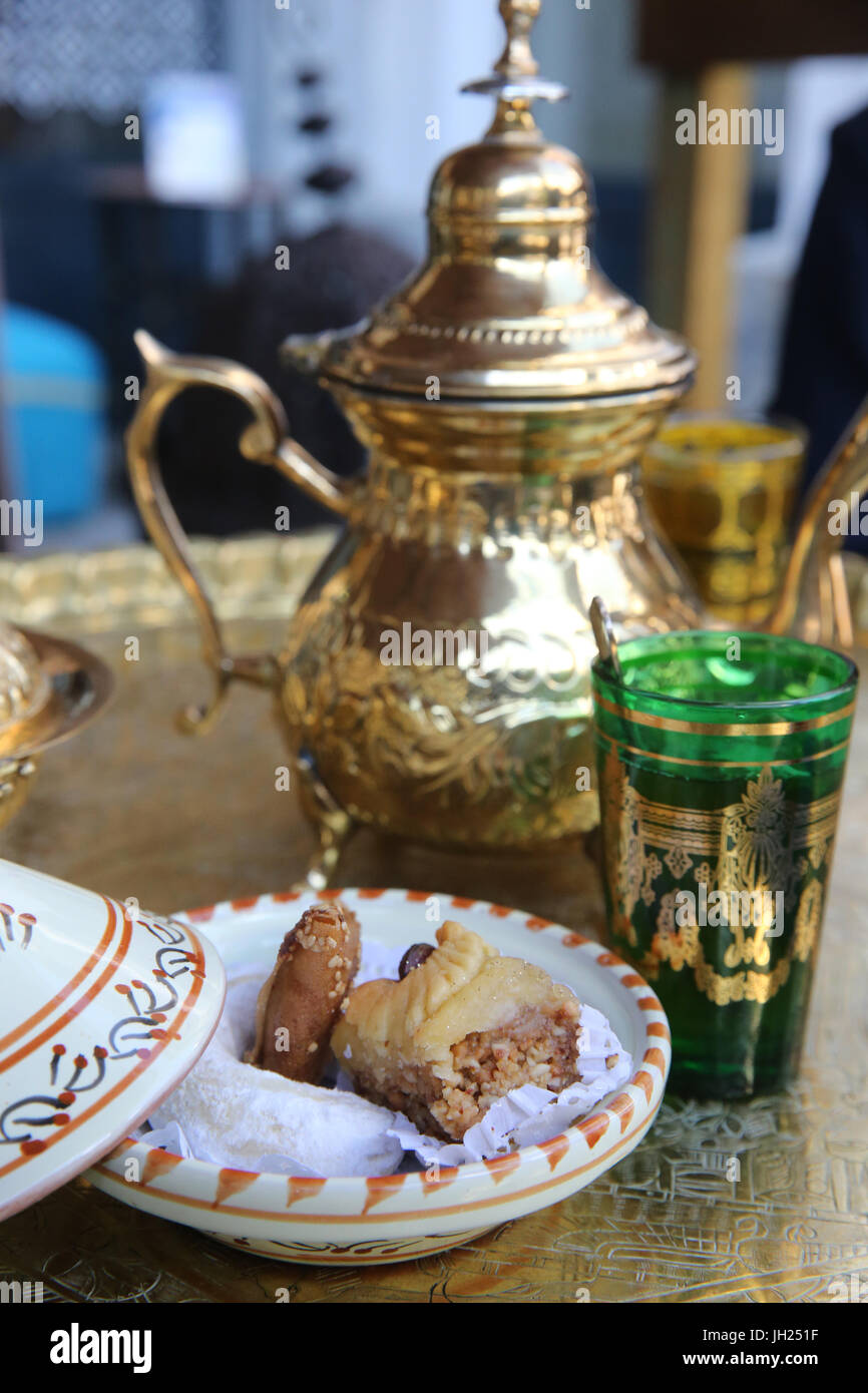 Traditional moroccan mint tea. and pastry.  France. Stock Photo