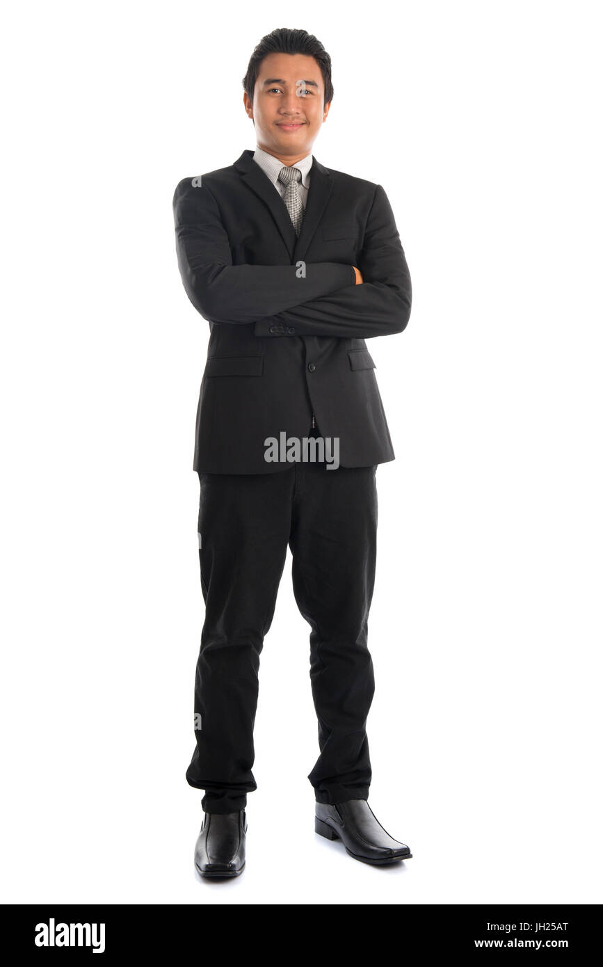 Full body attractive young Southeast Asian businessman arms crossed ...