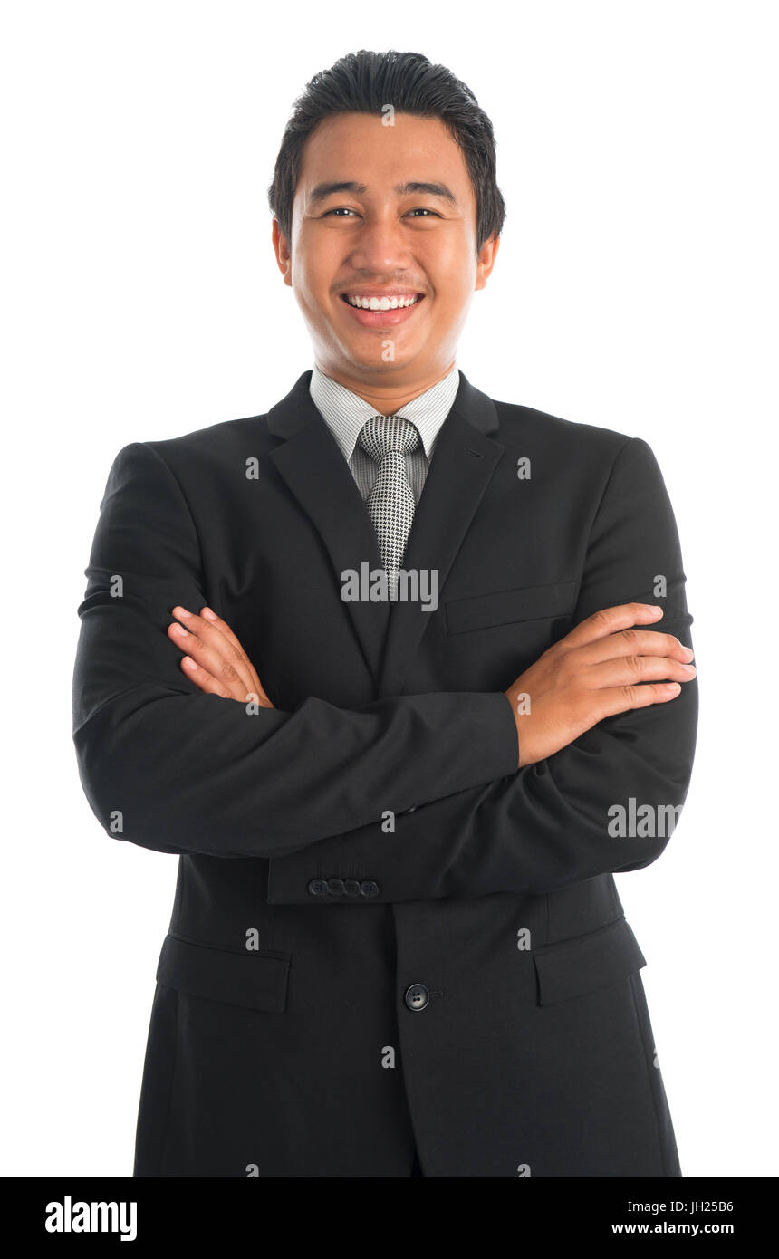 Portrait of handsome young Southeast Asian businessman arms crossed ...