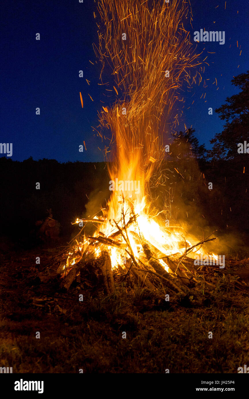 Big and loud fire out in the open at night Stock Photo