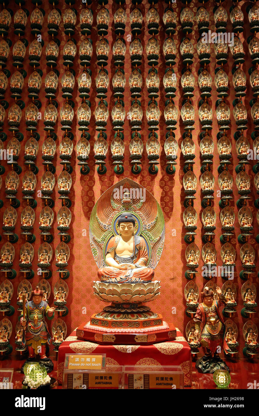 Buddha Tooth Relic Temple in Chinatown. Amitabha Buddha. Guardian deity for persons born in the year of the dog and pig. Singapore. Stock Photo