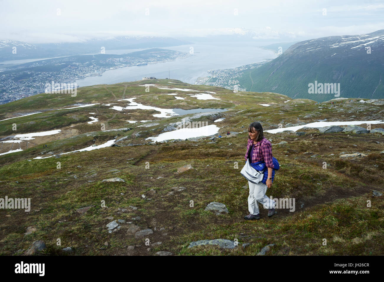 Hiker  walking up Fjellheisen, Tromsö, Norway Stock Photo