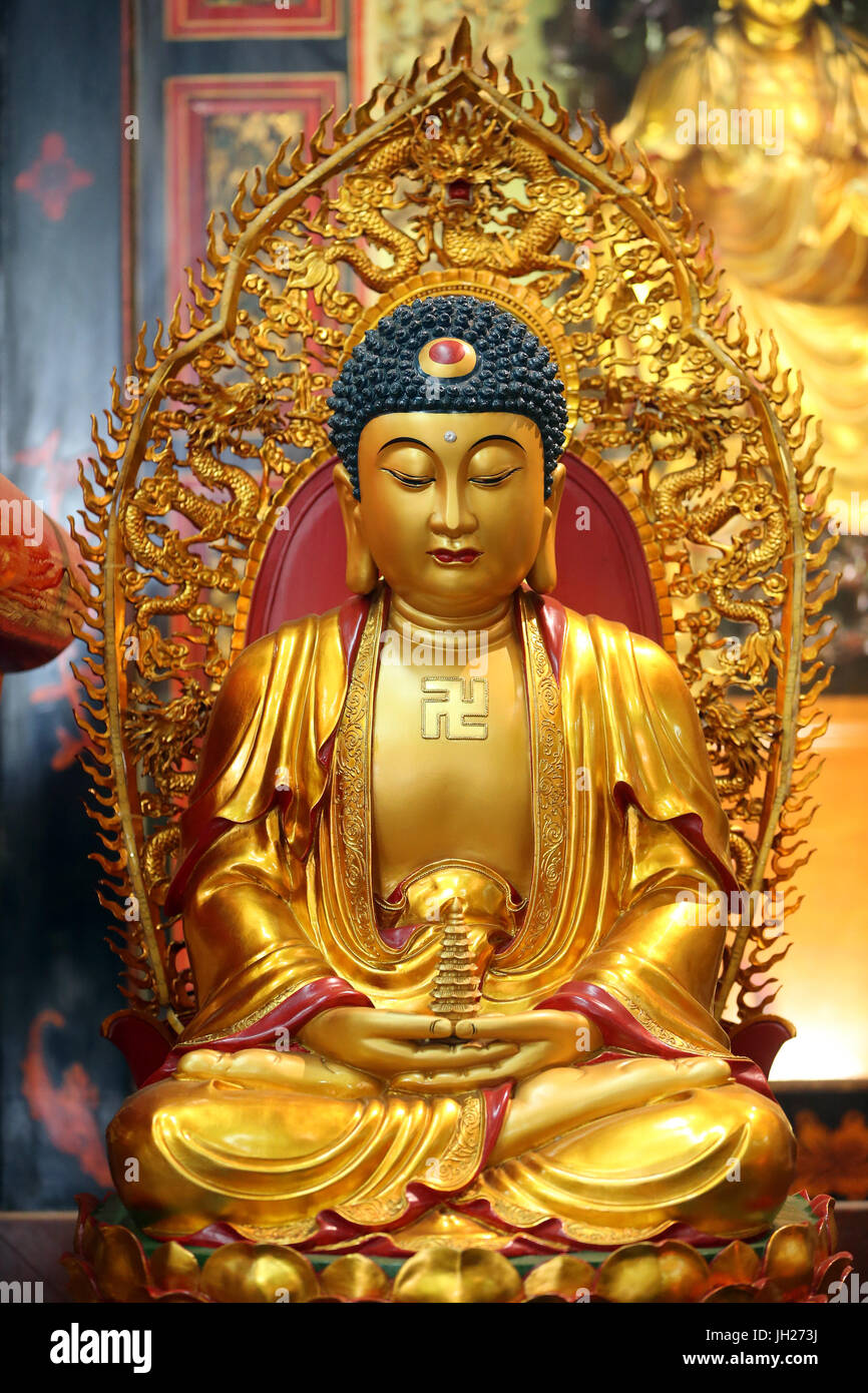Leong San buddhist temple.   Golden Buddha statue.  Singapore. Stock Photo