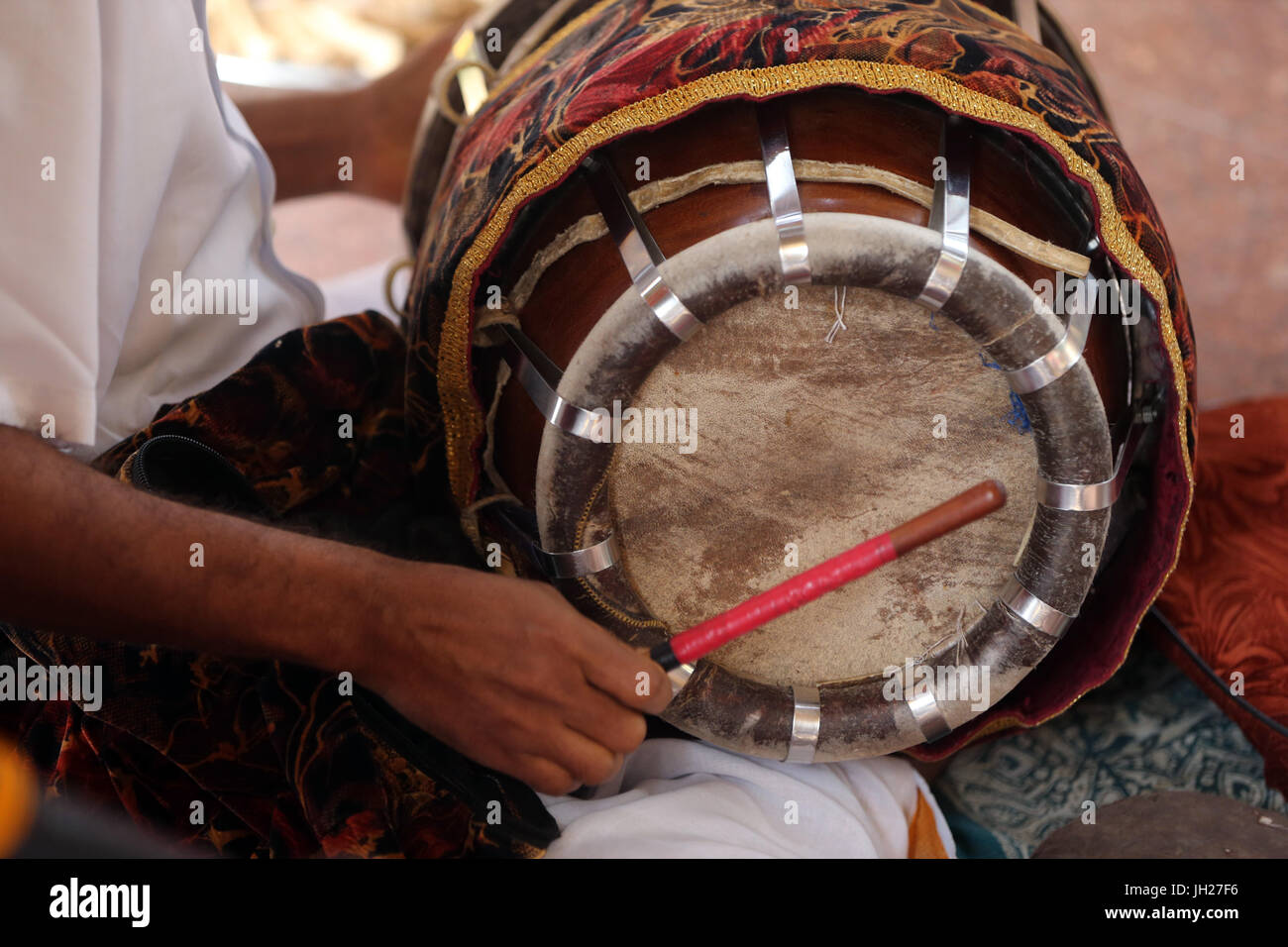 Musician Playing Drum During a Traditional Hindu Ceremony.  Sri Mariamman Hindu temple.  Singapore. Stock Photo