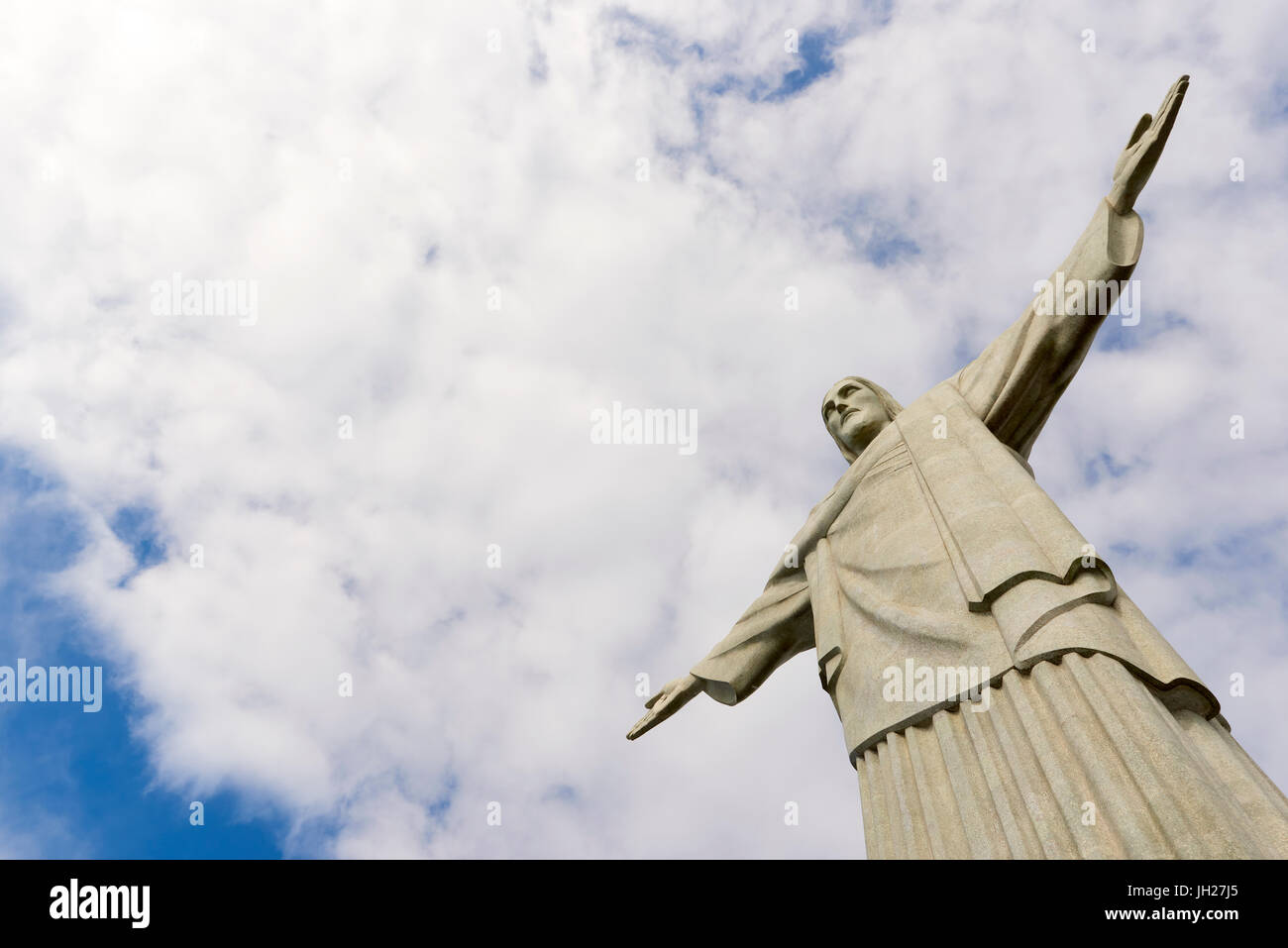 Low angle cropped shot of the iconic statue of Christ the Redeemer on a cloudy day, Rio de Janeiro, Brazil, South America Stock Photo
