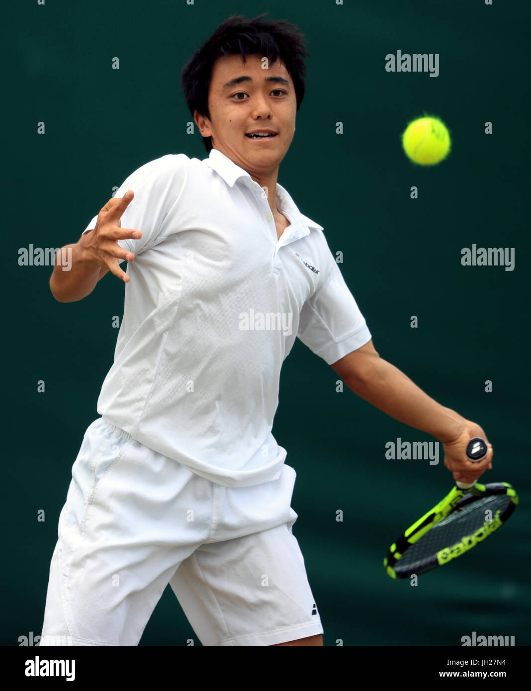 Yuta Shimizu in action in the boys singles on day Nine of the Wimbledon Championships at The All England Lawn Tennis and Croquet Club, Wimbledon