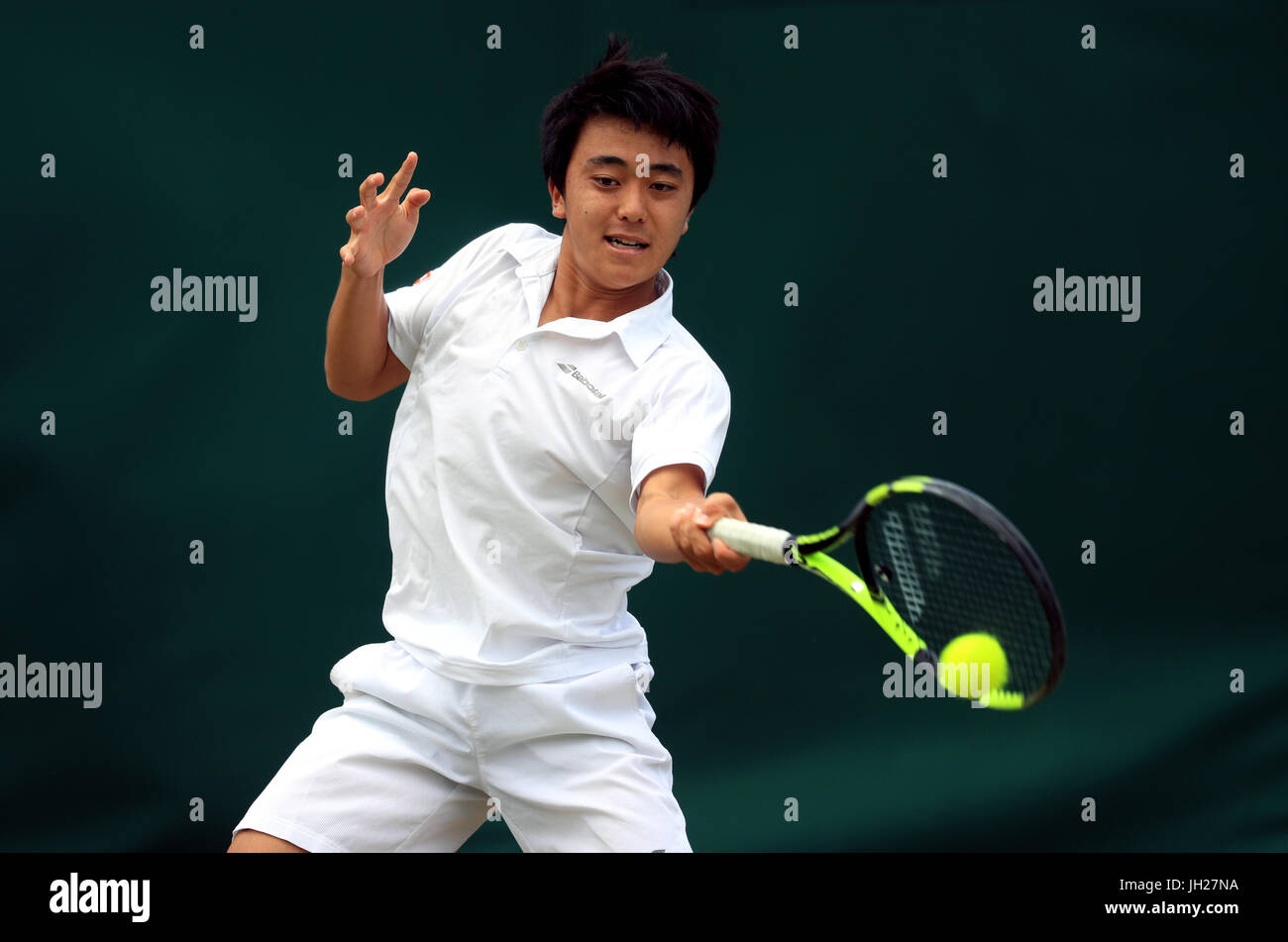 Yuta Shimizu in action in the boys singles on day Nine of the Wimbledon Championships at The All England Lawn Tennis and Croquet Club, Wimbledon
