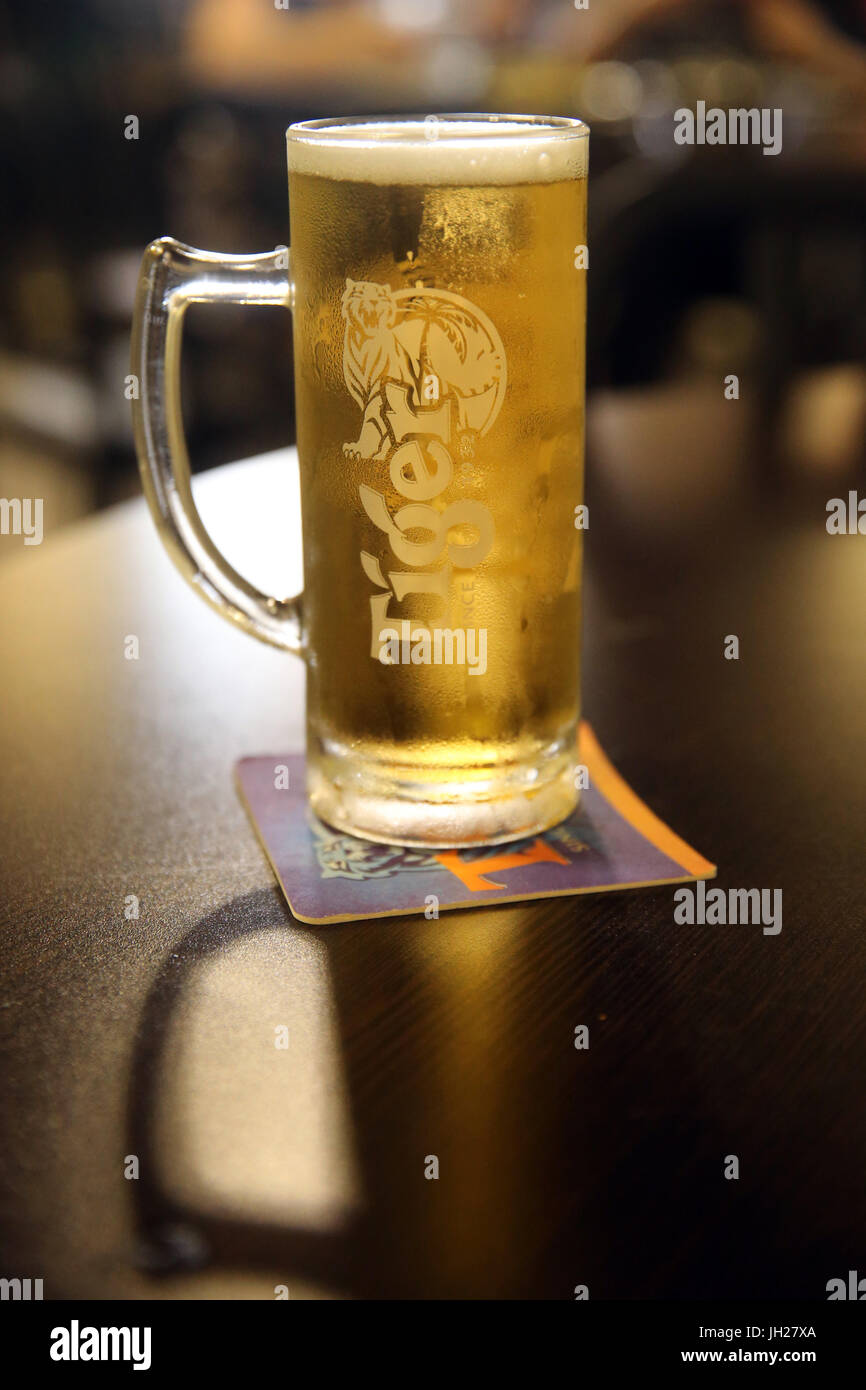 Glass of Tiger Beer in a bar.  Singapore. Stock Photo