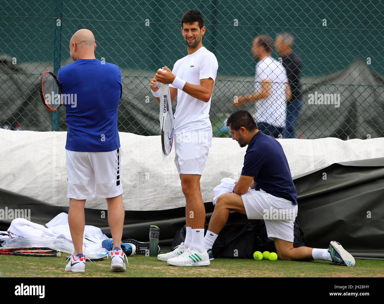 Novak Djokovic during a training session with coach Andre Agassi on day  Nine of the Wimbledon Championships at The All England Lawn tennis and  Croquet Club, Wimbledon Stock Photo - Alamy