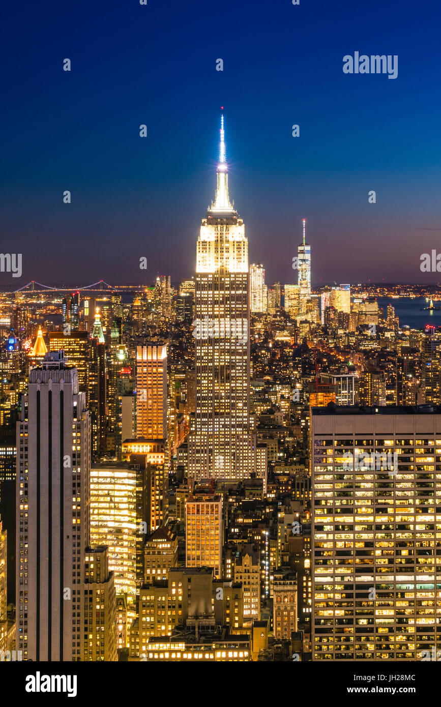Manhattan skyline and Empire State Building at dusk, New York City ...