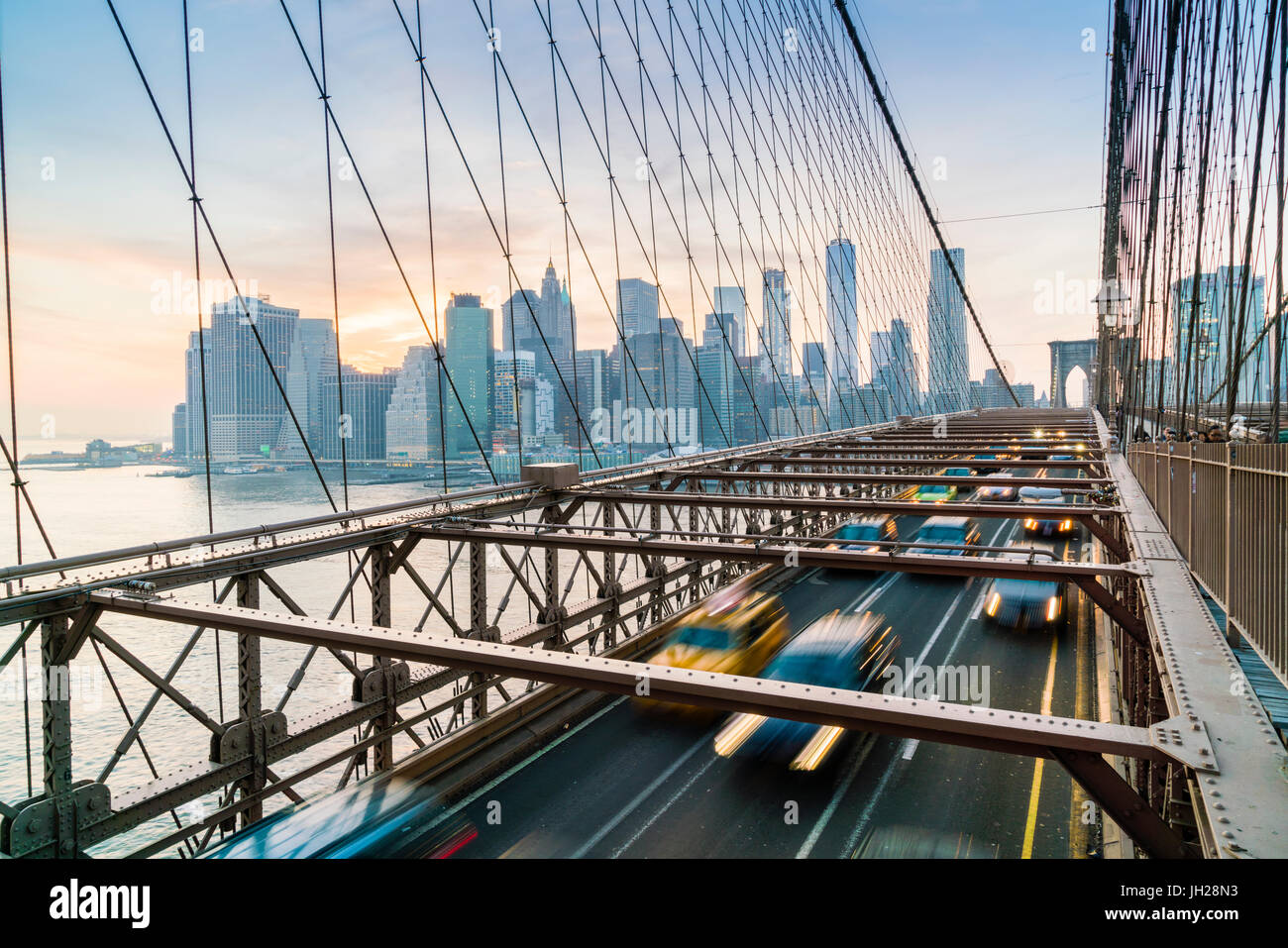 Rush hour traffic on Brooklyn Bridge and Manhattan skyline beyond, New York City, United States of America, North America Stock Photo