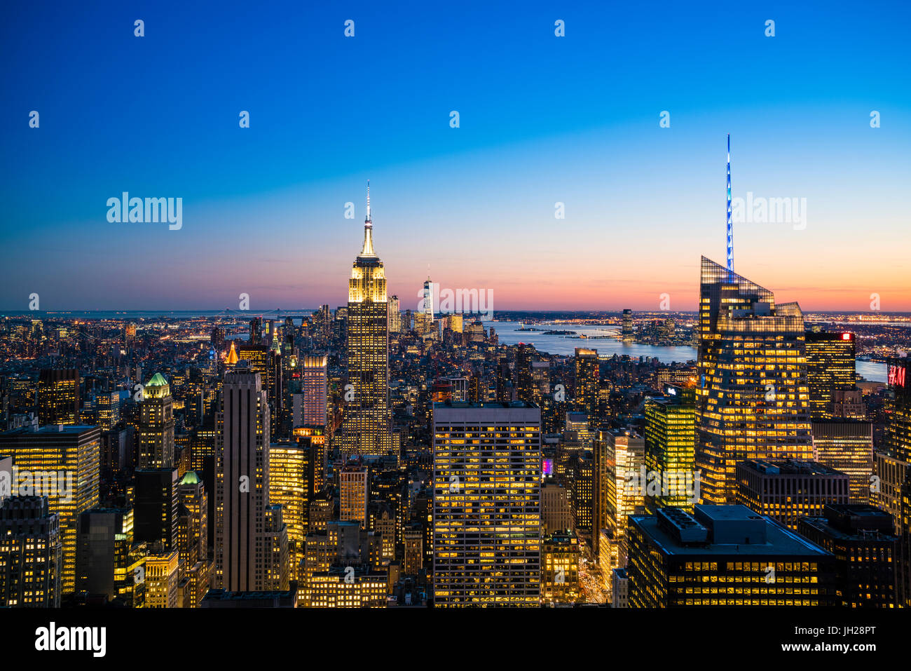 Manhattan skyline and Empire State Building at dusk, New York City ...