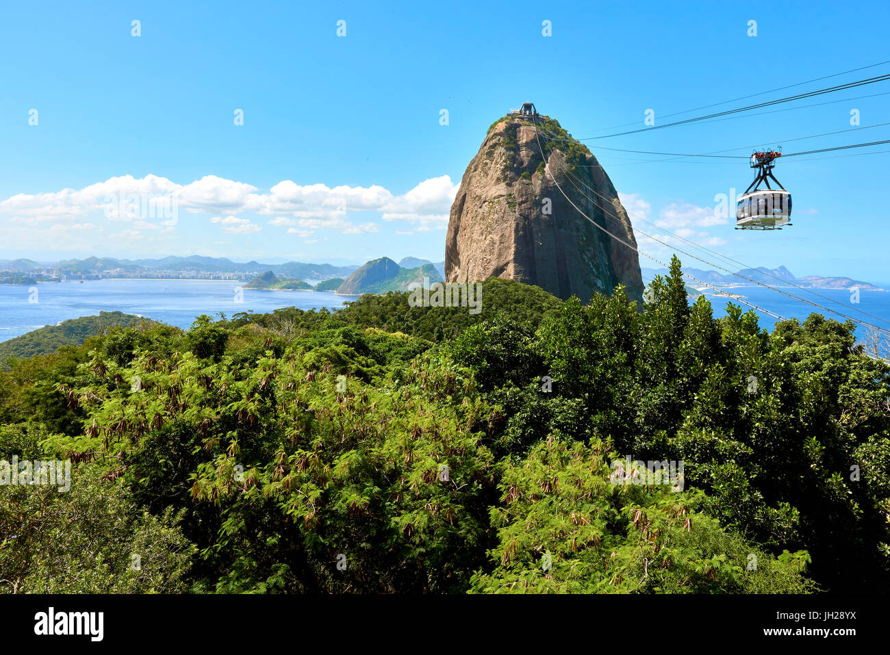 Cable car heading to Sugarloaf mountain seen from Morro da Urca, the first stop of the cable car, Rio de Janeiro, Brazil Stock Photo