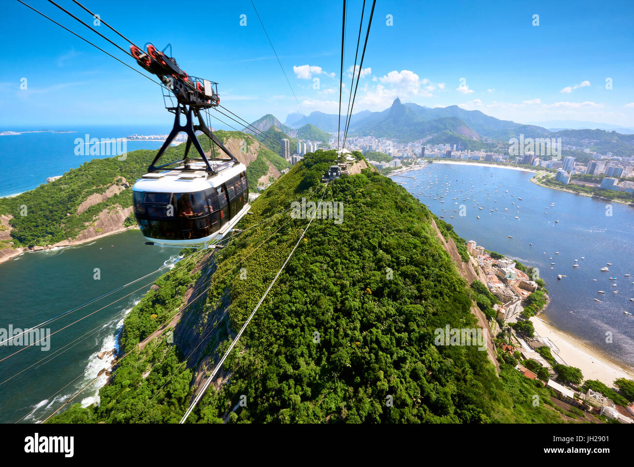 A cable car approaches the station atop Sugarloaf mountain, with a view
