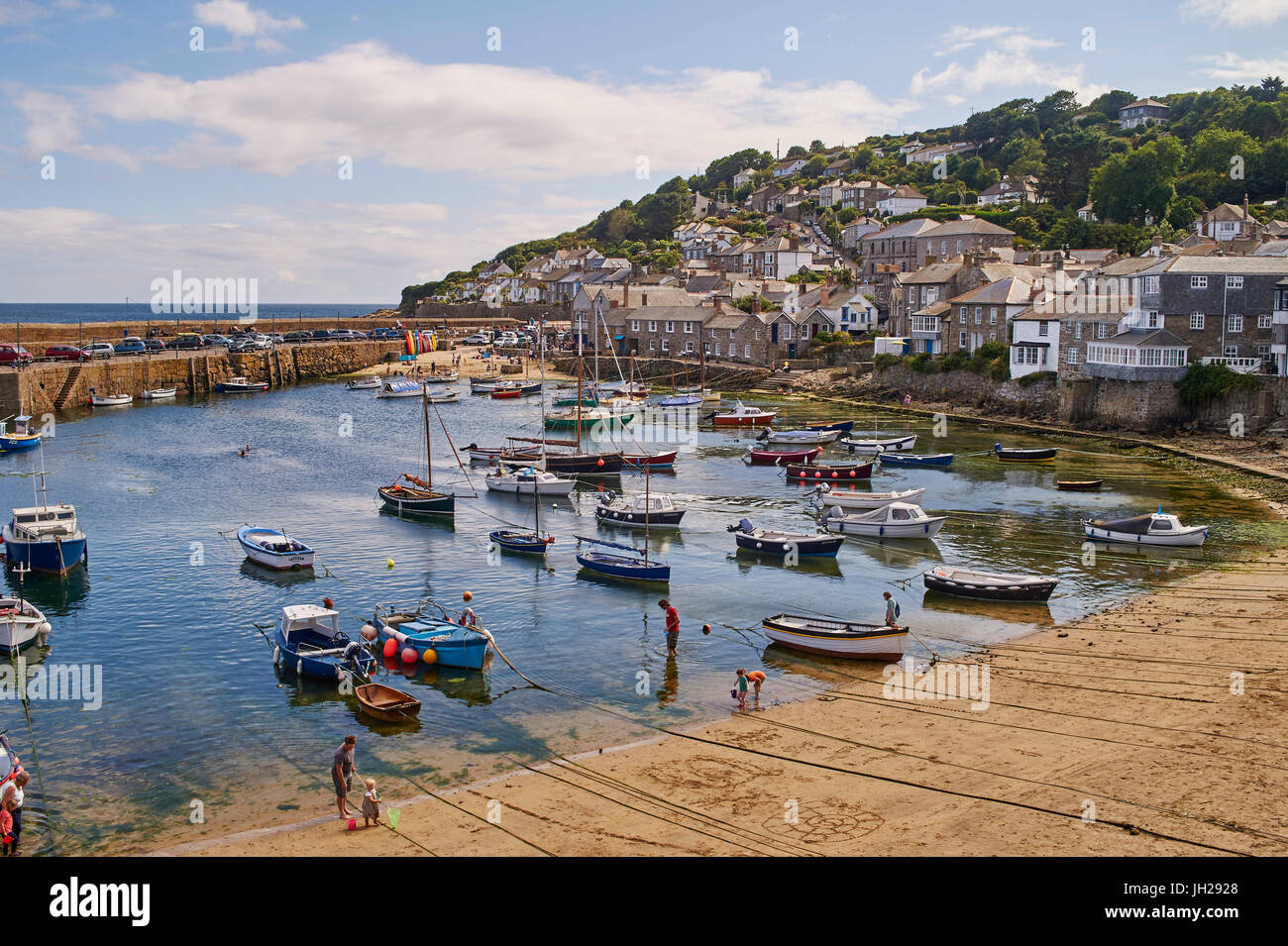 View of the harbour at mid-tide, Mousehole, Penwith, Cornwall, England, United Kingdom, Europe Stock Photo