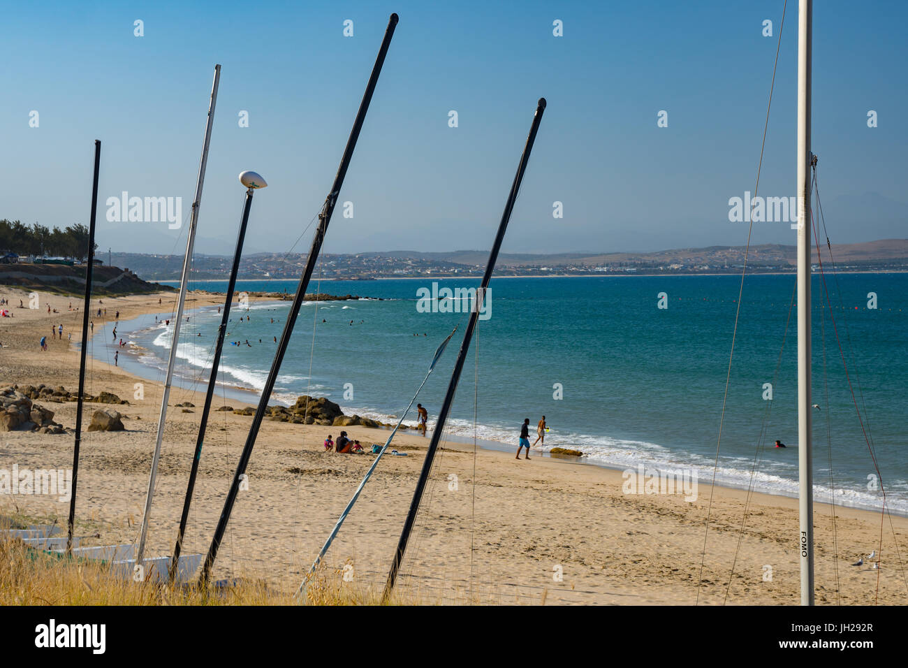 Beach seen though masts of beached boats, Mossel Bay, Western Cape, South Africa, Africa Stock Photo