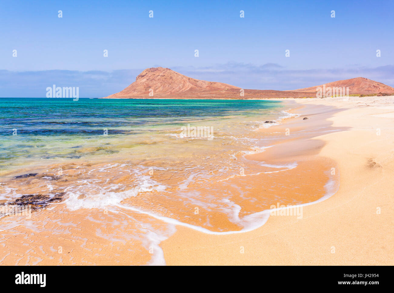 Empty sandy beach and bay near Monte Leao mountain (Sleeping Lion mountain), Sal Island, Cape Verde, Atlantic, Africa Stock Photo