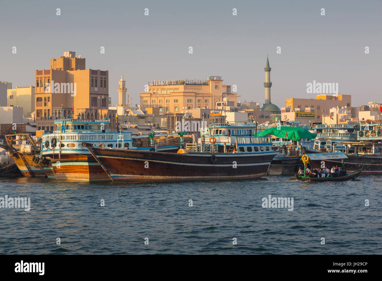 View of Deira District and boats on Dubai Creek, Bur Dubai, Dubai, United Arab Emirates, Middle East Stock Photo