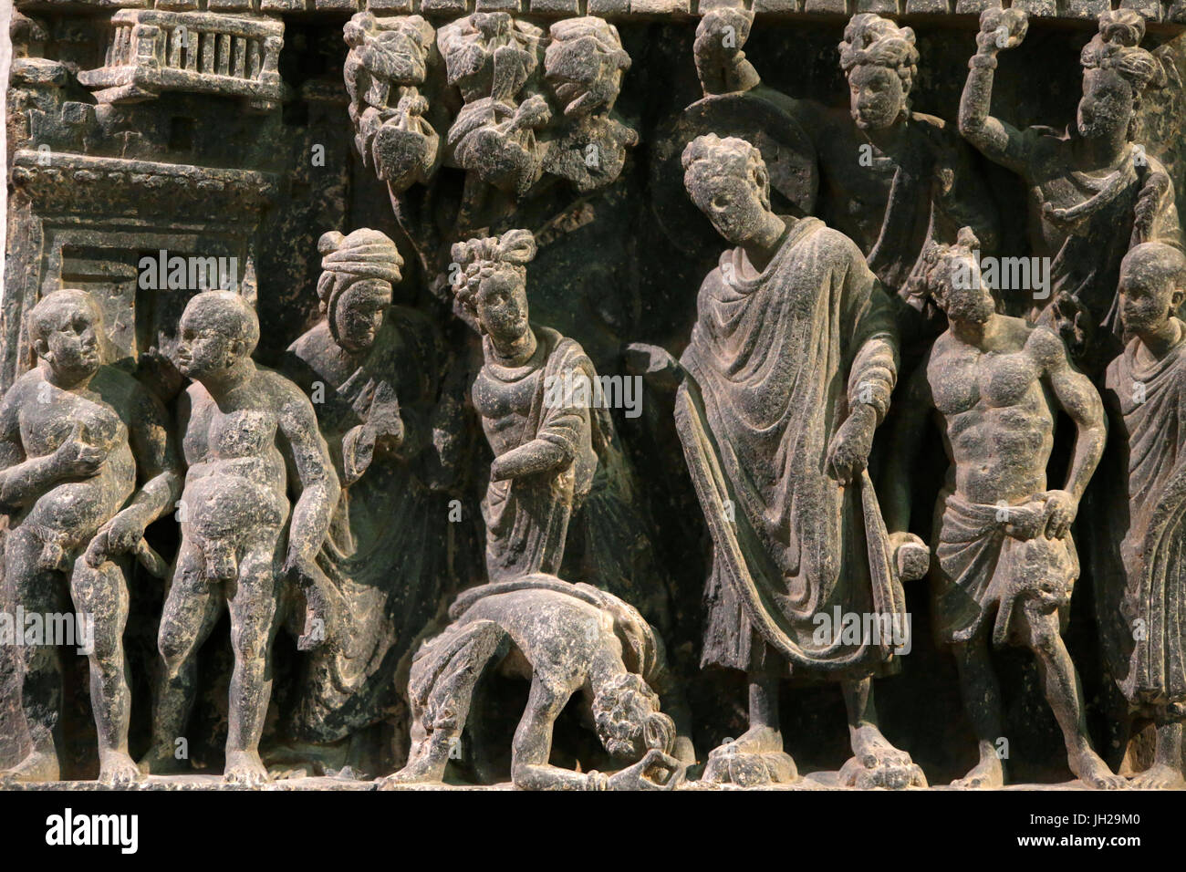 The Victoria and Albert Museum. Relief showing an attempt on the Buddha's life. 100-200.  Schist. Gandhara/Northwest Pakistan. United kingdom. Stock Photo