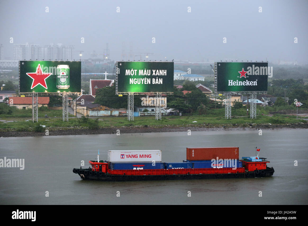 Vietnam, Ho Chi Minh City, ship on Saigon River during Heavy Monsoon Rain.  Ho Chi Minh City. Vietnam. Stock Photo