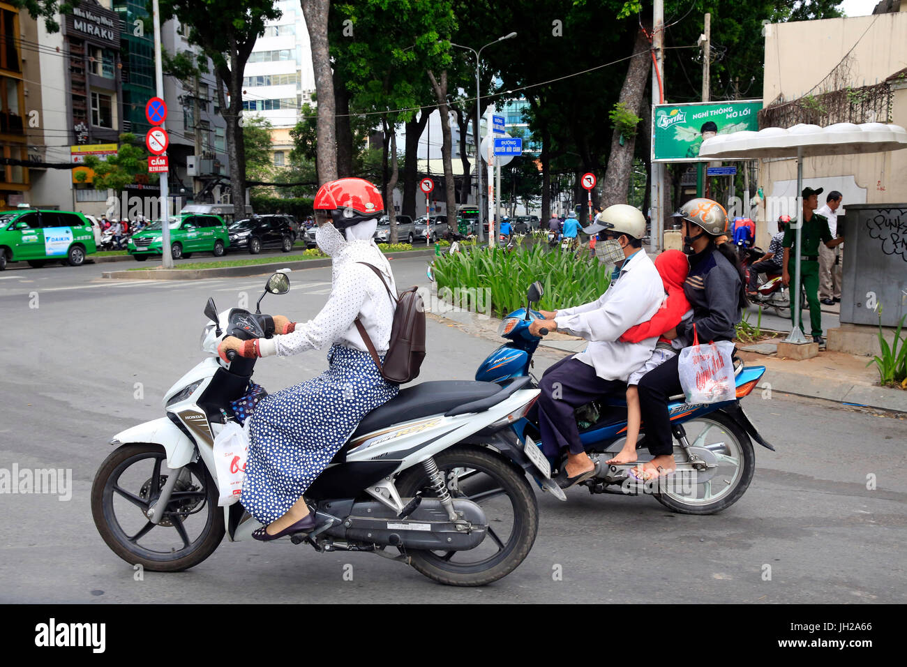Vietnam woman motorcycle city hi-res stock photography and images - Alamy