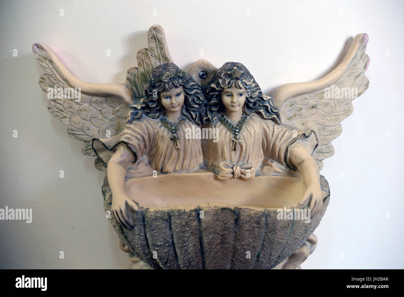 Ho Chi Minh city. Church of the Sacred Heart of Jesus ( Nha Tho Tan Dinh ). Holy water font with angels.  Ho chi Minh City. Vietnam. Stock Photo