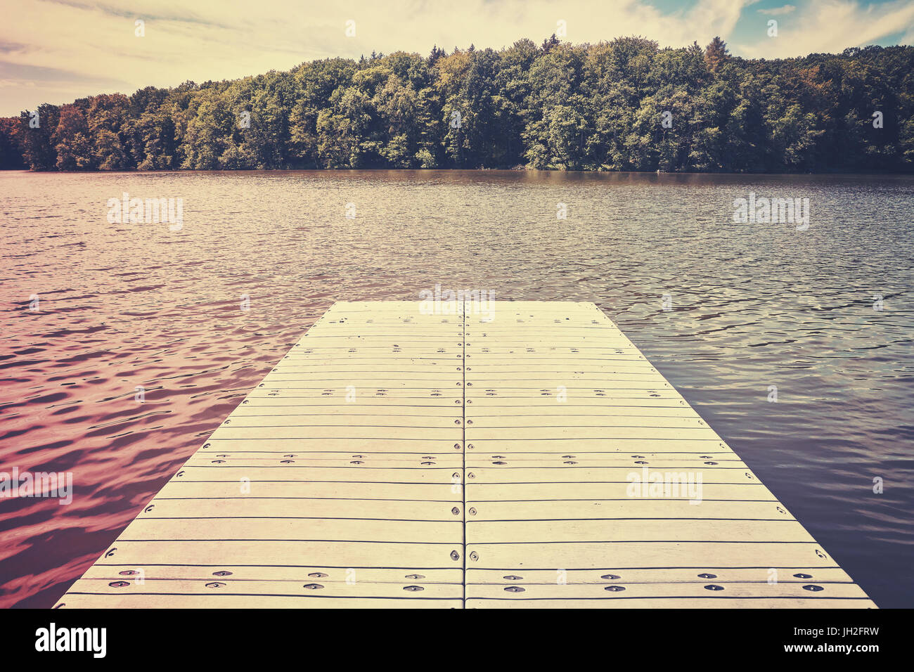 Color stylized picture of an empty pier, color toning applied. Stock Photo