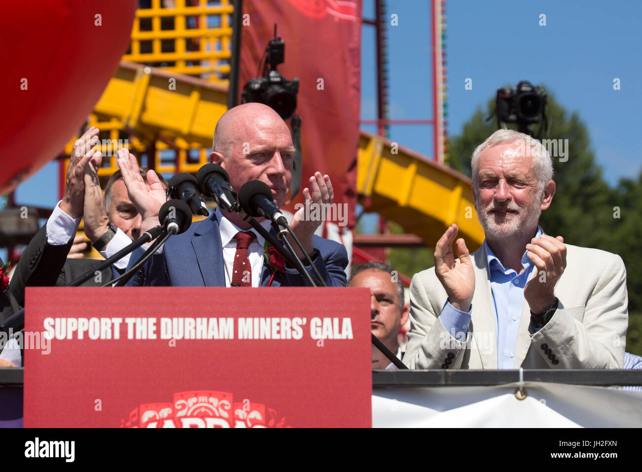 Matt Wrack, General Secretary of the Fire Brigades Union, is applauded by jeremy Corbyn, at the Durham Miners' Gala at Durham City, England. Stock Photo