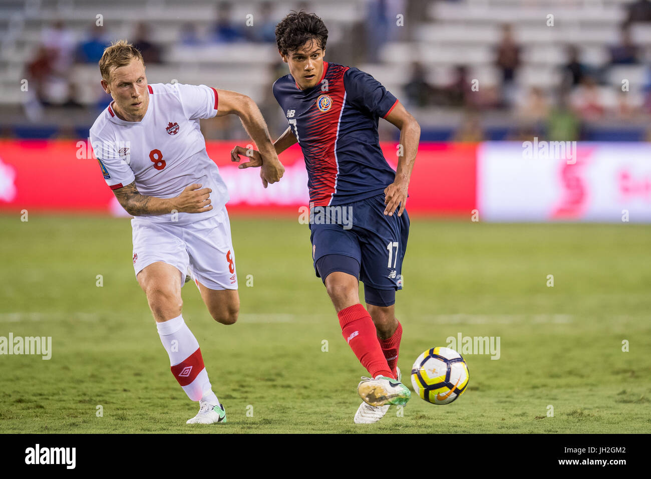 Houston, Texas, USA. 11th July, 2017. Costa Rica midfielder Yeltsin Tejeda (17) controls the ball in front of Canada midfielder Scott Arfield (8) during the 2nd half of an international CONCACAF Gold Cup soccer match between Canada and Costa Rica at BBVA Compass Stadium in Houston, TX on July 11th, 2017. The game ended in a 1-1 draw. Credit: Trask Smith/ZUMA Wire/Alamy Live News Stock Photo