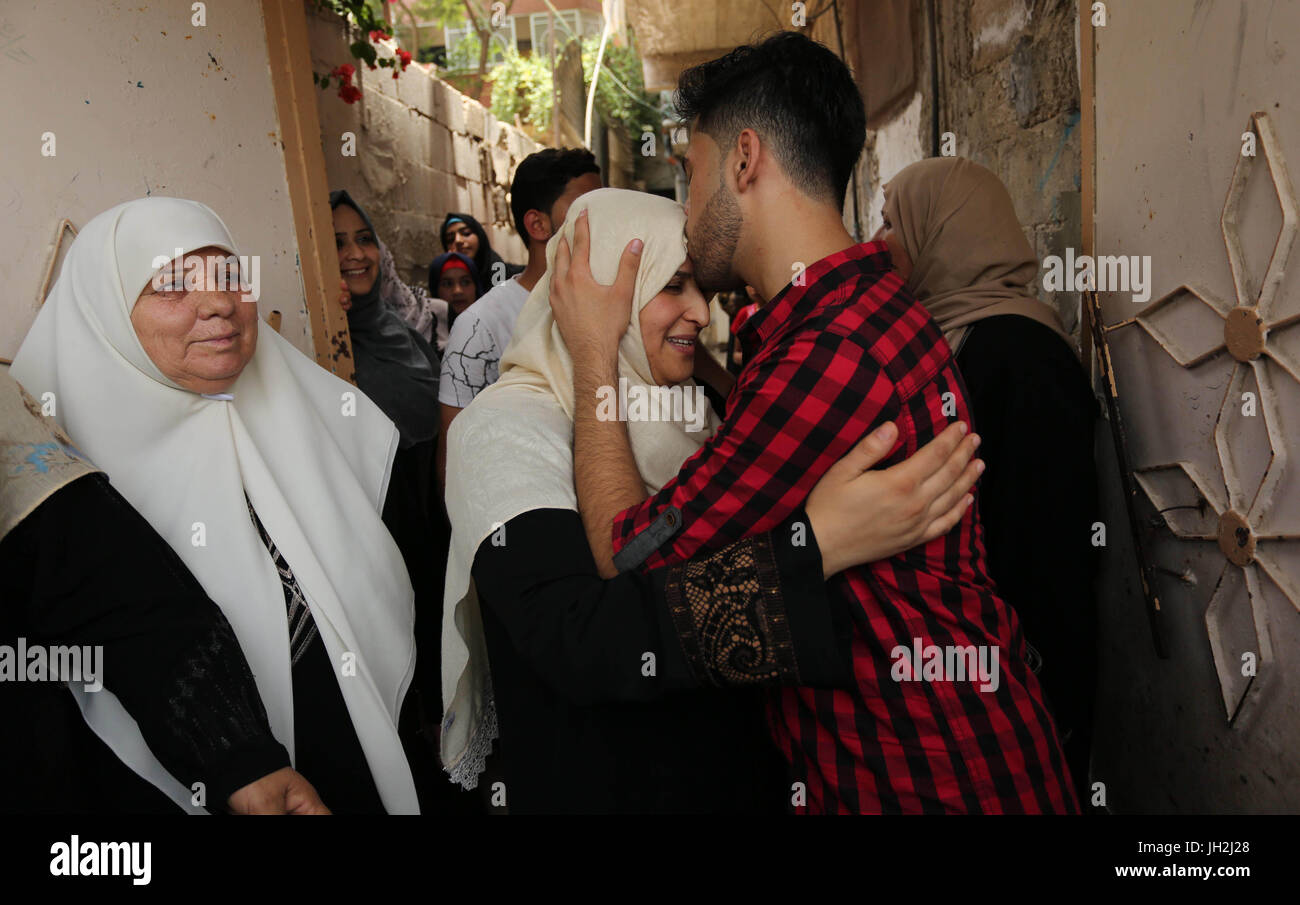 July 12, 2017 - Gaza City, Gaza Strip, Palestinian Territory - A Palestinian high school student, Loa'y Qnoua 99.7, celebrates with his family after heard the results of his final exams known as ''Tawjihi'', in Gaza city on July 12, 2017  (Credit Image: © Ashraf Amra/APA Images via ZUMA Wire) Stock Photo