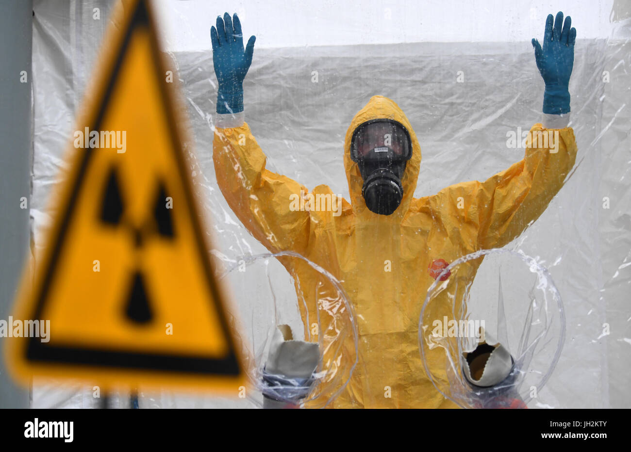 Scientist wearing radiation protection suit Vector Image