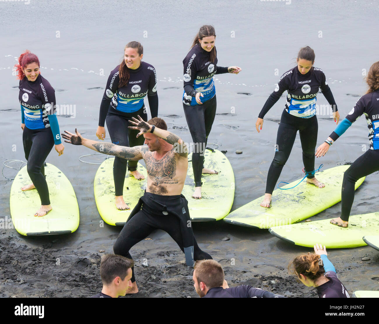 Las Palmas, Gran Canaria, Canary Islands, Spain. 12th July 2017. Weather: A busy afternoon at one of the many surf schools on the city beach in Las Palmas as locals head to the beaches for the long summer holidays. Credit: ALAN DAWSON/Alamy Live News Stock Photo