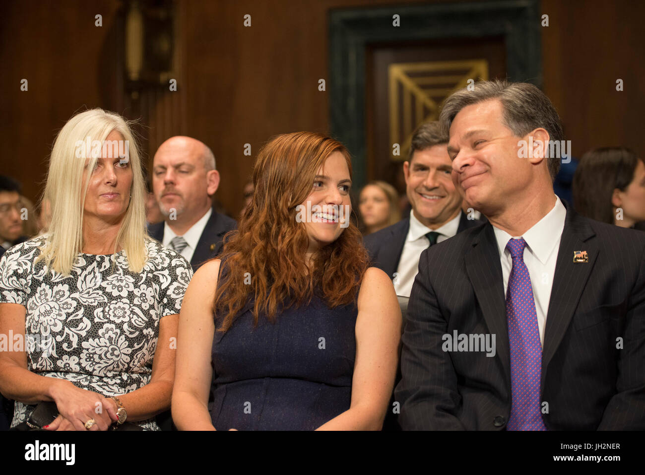 Washington DC, July 12, 2017, USA: Christopher Wray testifies at his Senate confirmation hearing to be the next director of the FBI. He sits with his daughter, Caroline and his wife, Helen Garrison Howell before he testifies. Patsy Lynch/MediaPunch Stock Photo