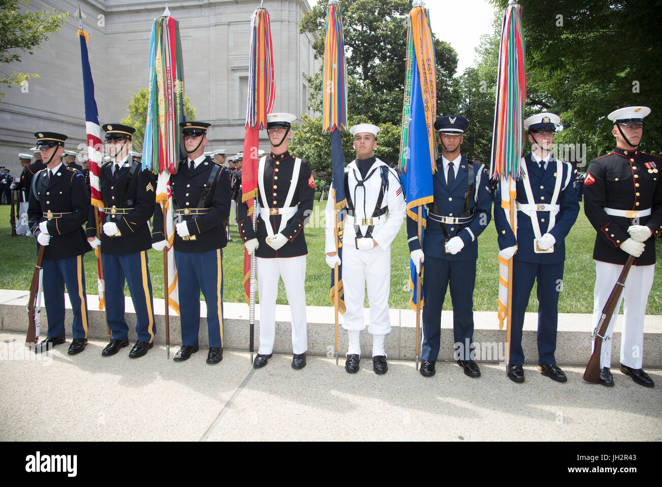 A joint military forces color guard prepares to march in the National Independence Day Parade in ...