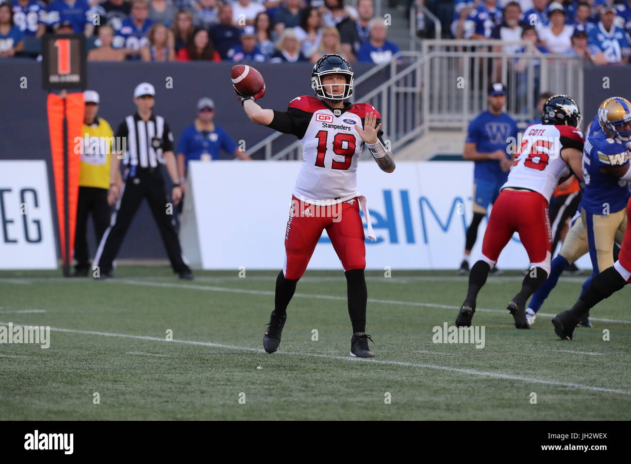 Winnipeg, Manitoba, CAN. 7th July, 2017. July 7, 2017; Winnipeg, Manitoba, CAN; Calgary Stampeders quarterback Bo Levi Mitchell (19) looks to the sidelines as he prepares to throw the ball during the first quarter against the Winnipeg Blue Bombers at Investors Group Field. Mandatory Credit: Bruce Fedyck- Zuma Media Credit: Bruce Fedyck/ZUMA Wire/Alamy Live News Stock Photo