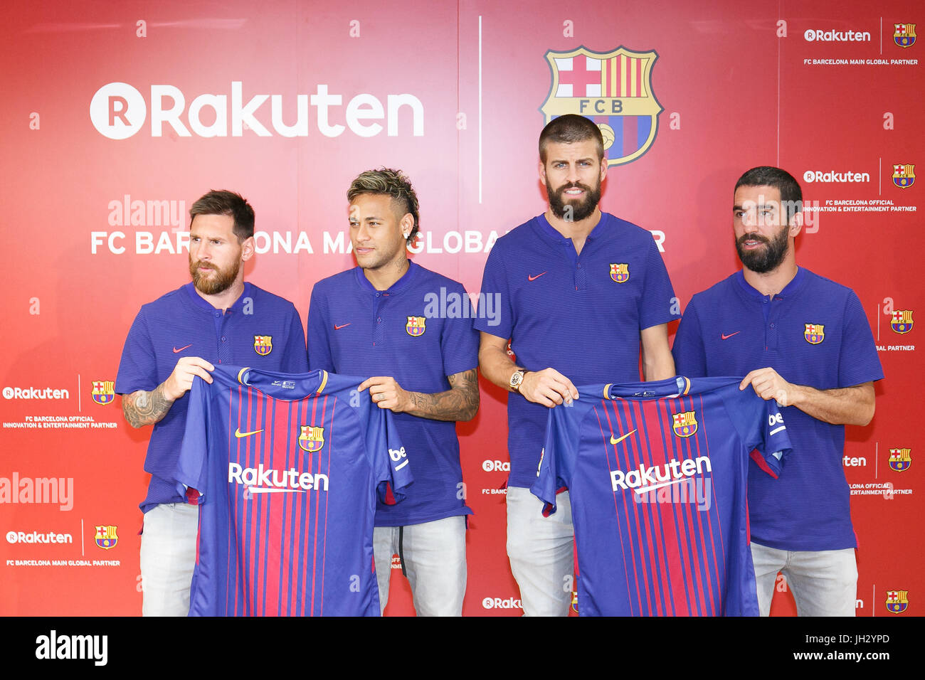 L to R) FC Barcelona players Lionel Messi, Neymar, Gerard Pique and Arda  Turan show off the club's new 2017-18 season uniform during a press event  at Rakuten Crimson House headquarters in