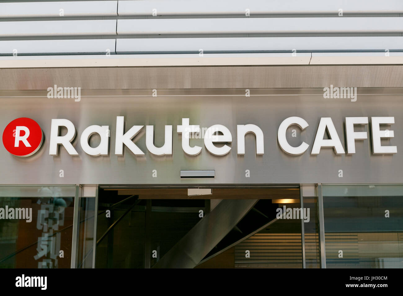A signboard of Rakuten Cafe on display outside its store in Shibuya on July 13, 2017, Tokyo, Japan. The Japanese e-commerce firm Rakuten Inc. became FC Barcelona's Main Global Partner from the 2017-18 season as part of a four-year sponsorship deal that was signed in 2016. Barcelona's match-day jerseys for the new season will also be unveiled in Tokyo and include the Rakuten logo for the first time. (Photo by Rodrigo Reyes Marin/AFLO) Stock Photo