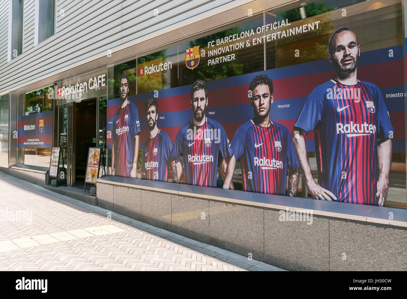 Pictures and logos of the Spanish soccer club FC Barcelona on display outside at the Rakuten Cafe in Shibuya on July 13, 2017, Tokyo, Japan. The Japanese e-commerce firm Rakuten Inc. became FC Barcelona's Main Global Partner from the 2017-18 season as part of a four-year sponsorship deal that was signed in 2016. Barcelona's match-day jerseys for the new season will also be unveiled in Tokyo and include the Rakuten logo for the first time. (Photo by Rodrigo Reyes Marin/AFLO) Stock Photo